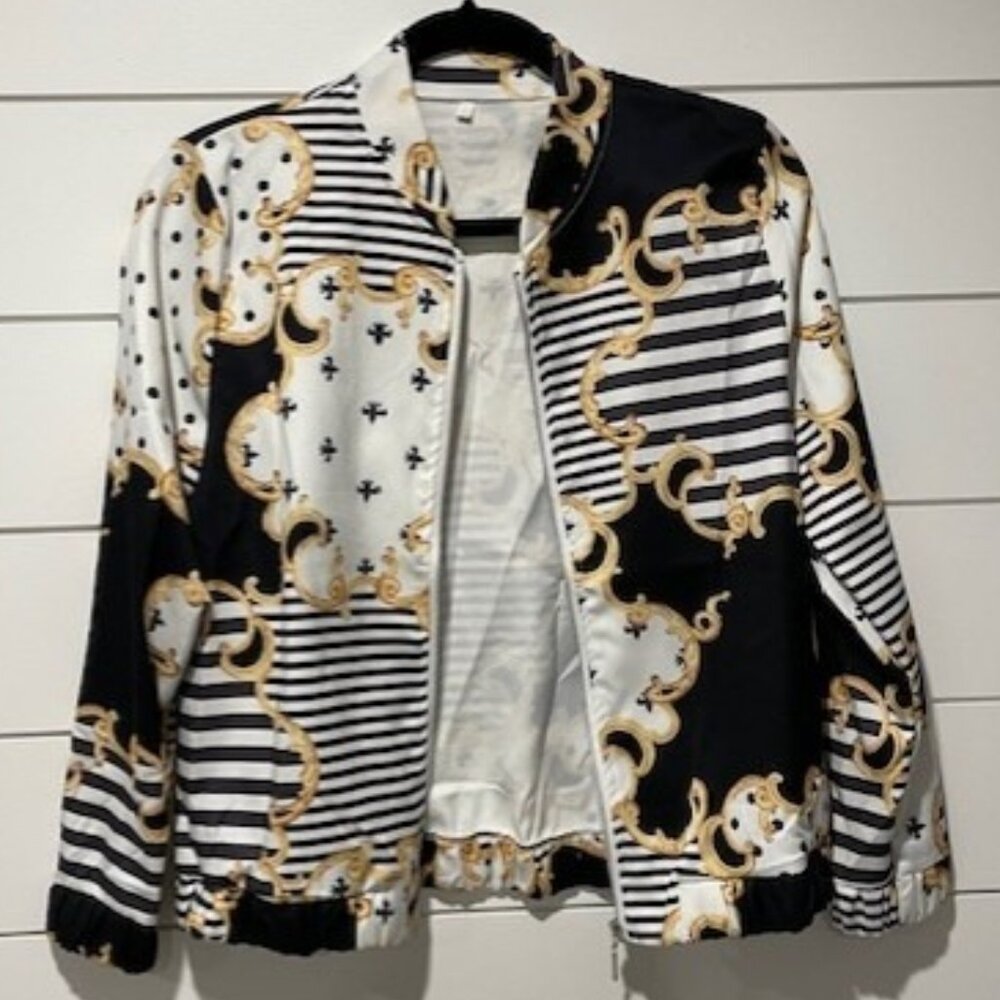 Black, white and gold colored bomber jacket